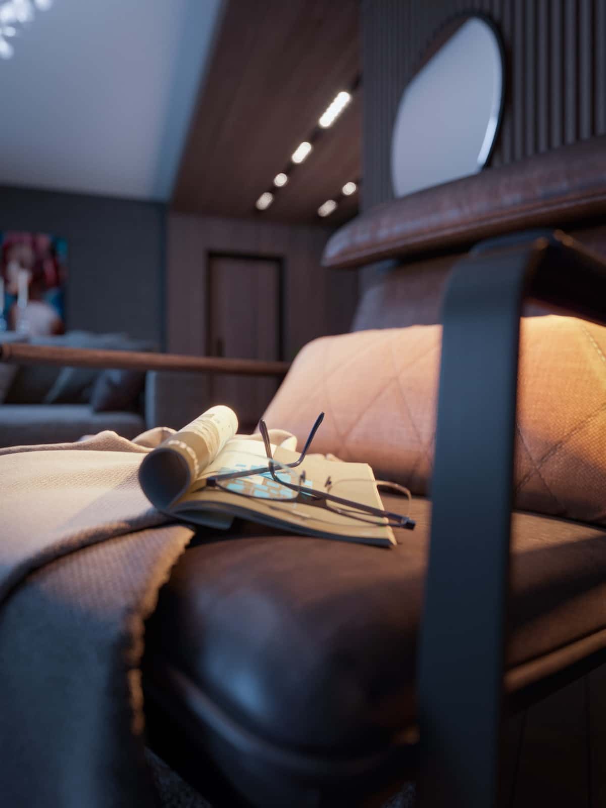 Close view of leather upholstery and a folded newspaper