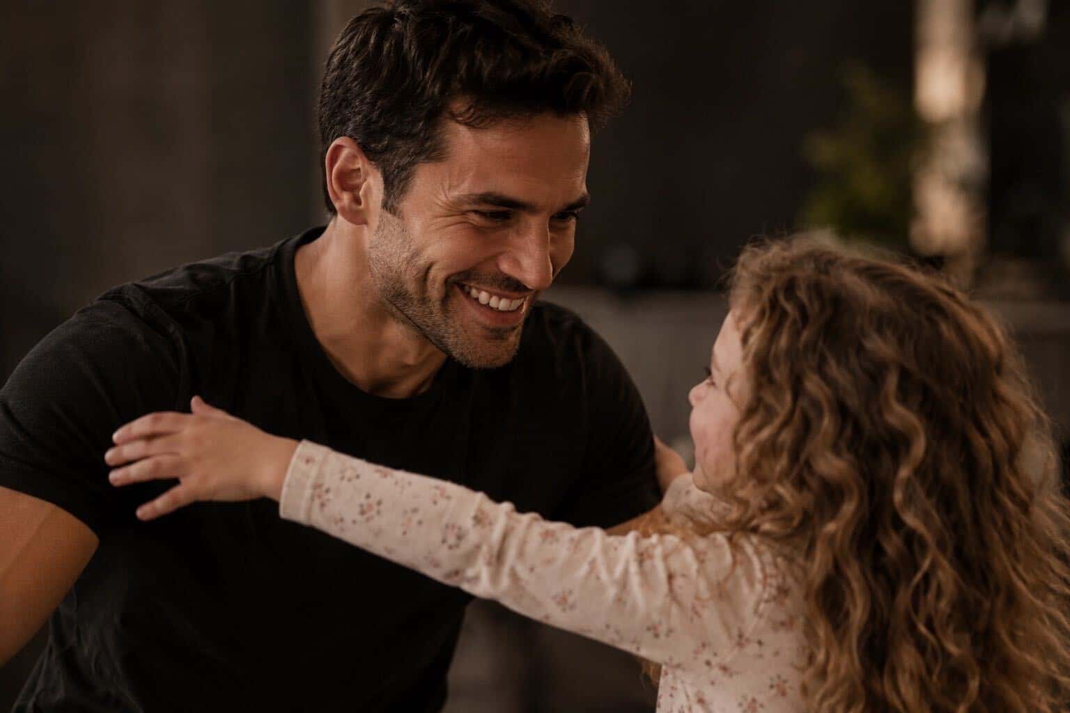 A father welcoming his daughter with open arms
